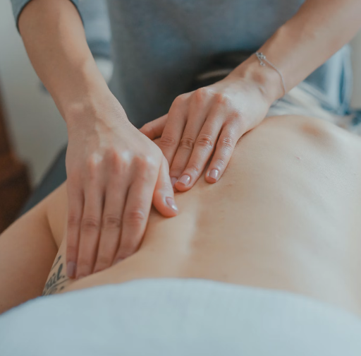 Physical therapist performing soft tissue mobilization on a patient's leg